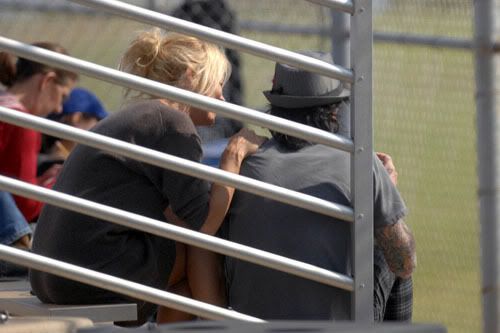 Pamela Anderson and Tommy Lee are shown at one of their son's baseball games 